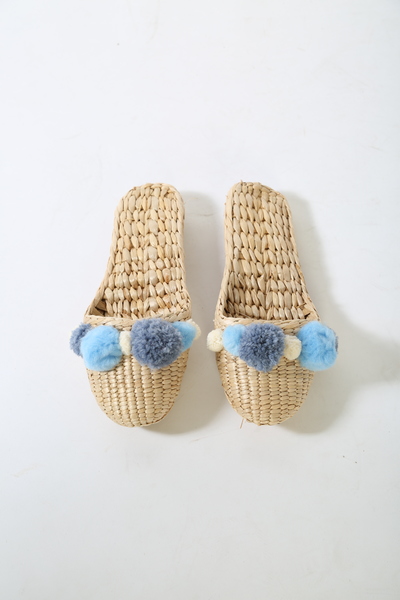 Folk Fortune handwoven slippers with Serenity blue pom poms Folk Fortune handwoven slippers with Serenity blue pom poms