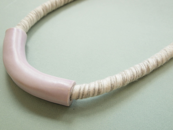 YYY short tube necklace on variegated cord YYY short tube necklace on variegated cord