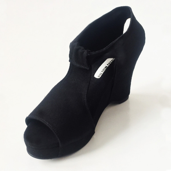 Slow and Steady Wins the Race Wedge Sandal in Black with White Stitching Slow and Steady Wins the Race Wedge Sandal in Black with White Stitching